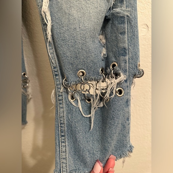 Jeans are cropped at the ankle and wide in the waist. - Picture 6 of 9